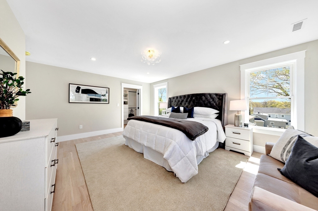354 Ridge Street Arlington, MA 02474 - Photo 26 of 42 a bedroom with a large bed and a couch