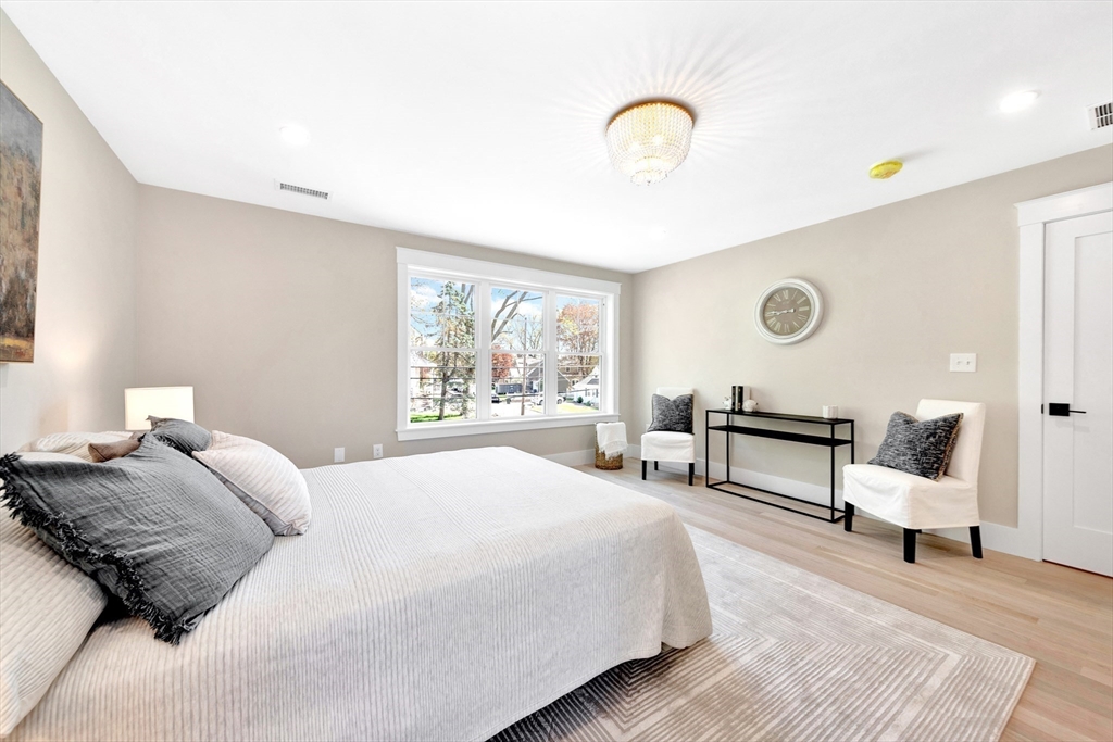 354 Ridge Street Arlington, MA 02474 - Photo 30 of 42 a bedroom with bed and a window