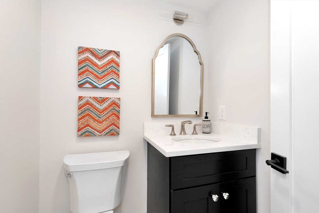 354 Ridge Street Arlington, MA 02474 - Photo 34 of 42 a bathroom with a sink and a mirror
