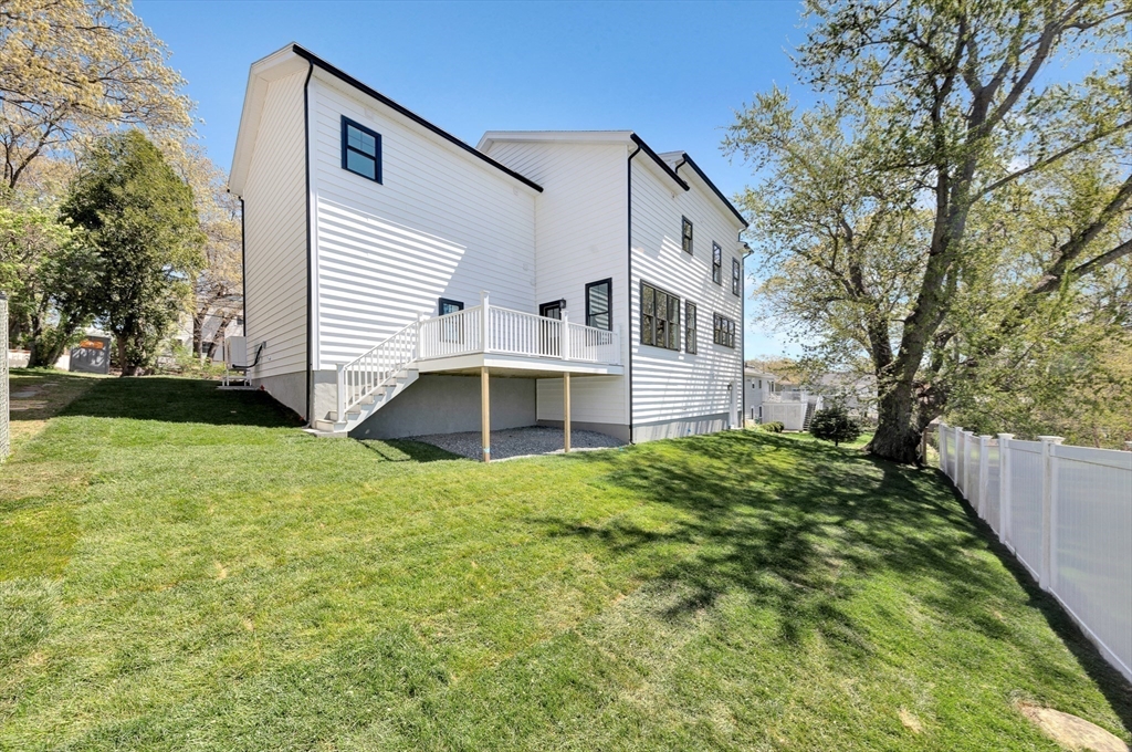 354 Ridge Street Arlington, MA 02474 - Photo 38 of 42 a view of a house with a yard