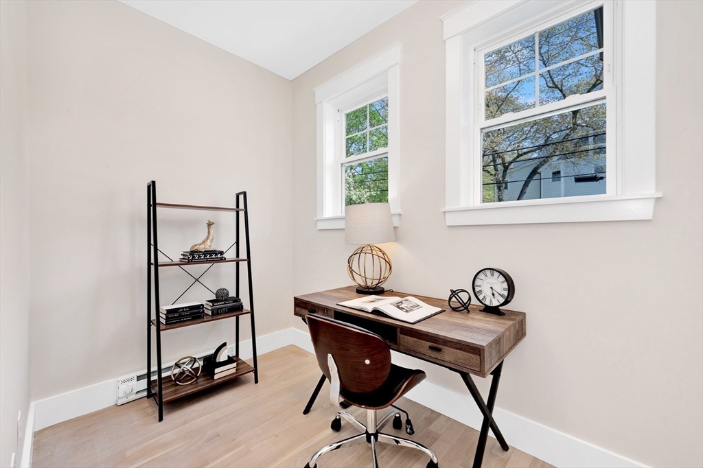354 Ridge Street Arlington, MA 02474 - Photo 10 of 42 a view of a workspace room with gym equipment