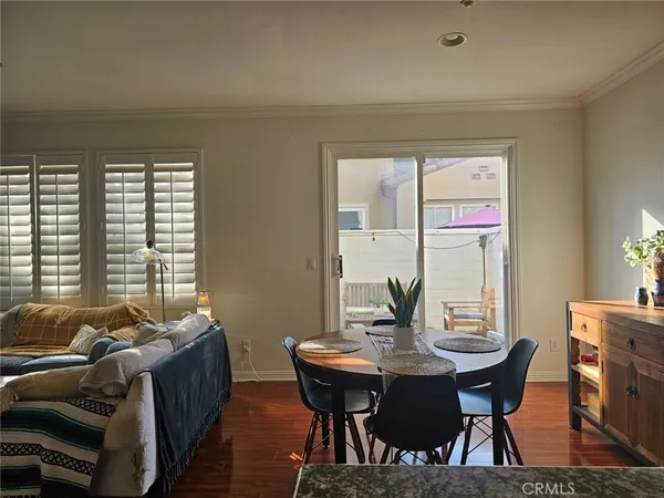 a view of a dining room with furniture and window