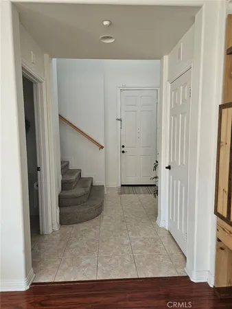 wooden floor and closet area with wooden floor