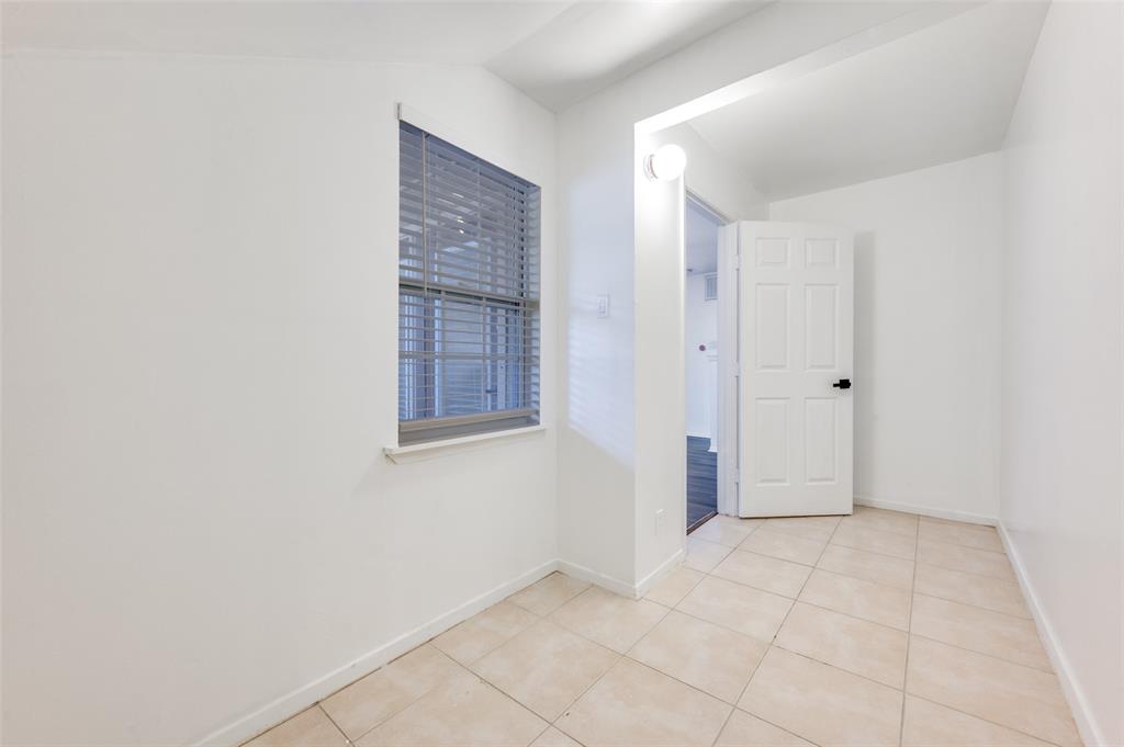 5550 Spring Valley Road, Unit E22 Dallas, TX 75254 - Photo 7 of 14 an empty room with windows and closet