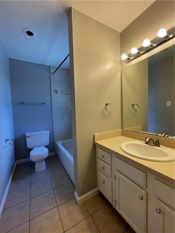 2114 Zephyr Lane Round Rock, TX 78664 - Photo 18 of 27 a spacious bathroom with a double vanity sink mirror and toilet