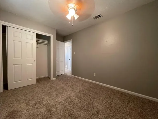 an empty room with a bathroom
