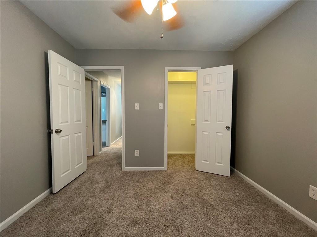 2114 Zephyr Lane Round Rock, TX 78664 - Photo 22 of 27 an empty room with closet and a bathroom