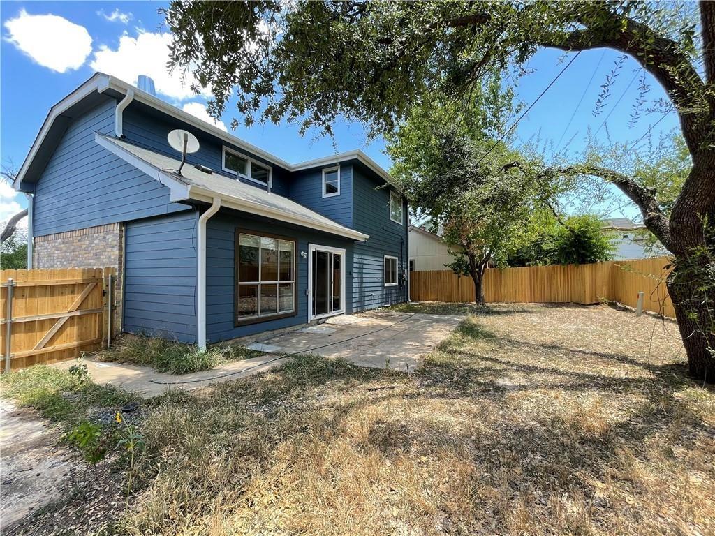 2114 Zephyr Lane Round Rock, TX 78664 - Photo 25 of 27 a front view of a house with a yard and garage