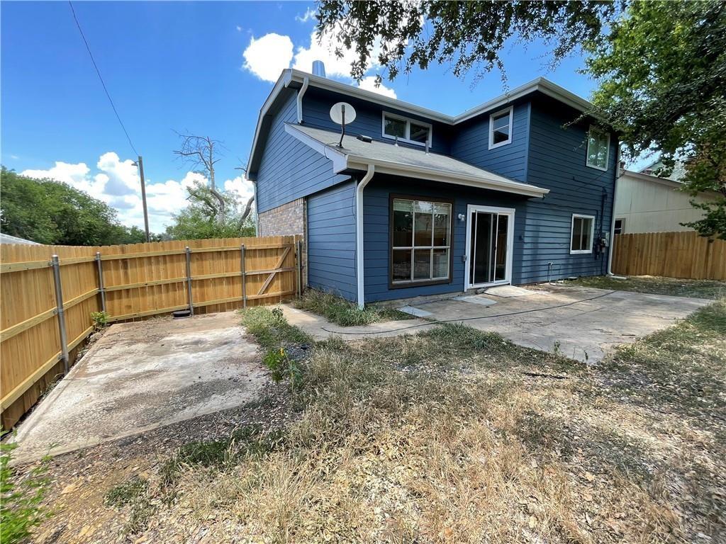 2114 Zephyr Lane Round Rock, TX 78664 - Photo 26 of 27 a view of a house with a yard and wooden fence