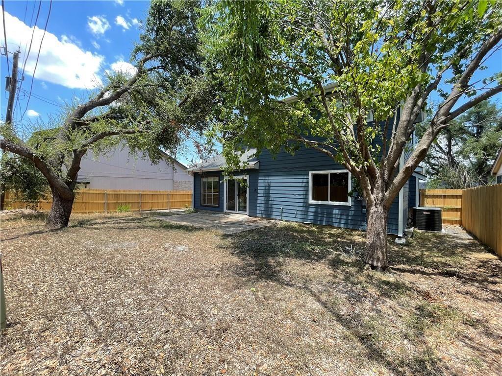 2114 Zephyr Lane Round Rock, TX 78664 - Photo 27 of 27 a tree in front of a white house