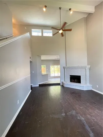 a view of empty room with a fireplace