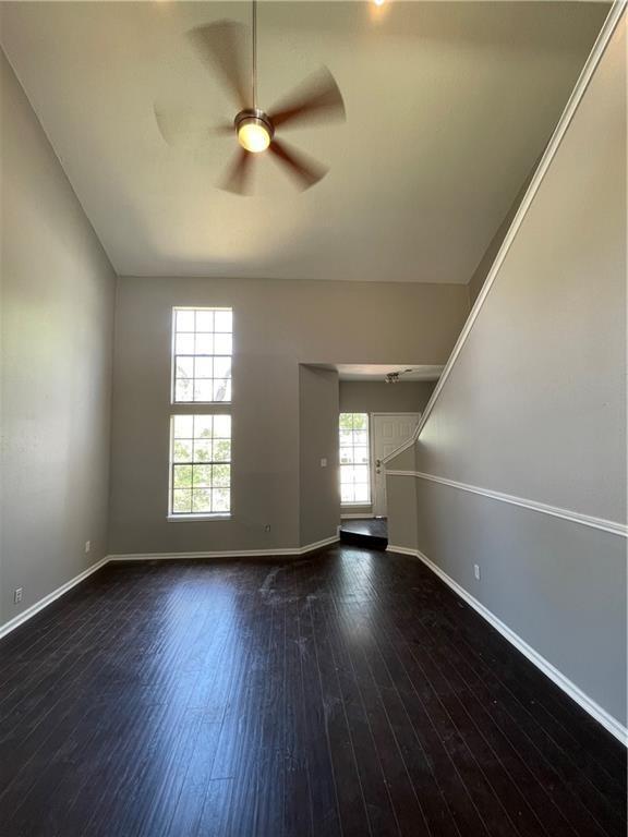 2114 Zephyr Lane Round Rock, TX 78664 - Photo 6 of 27 wooden floor in an empty room with a window