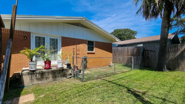 a backyard of a house with seating space