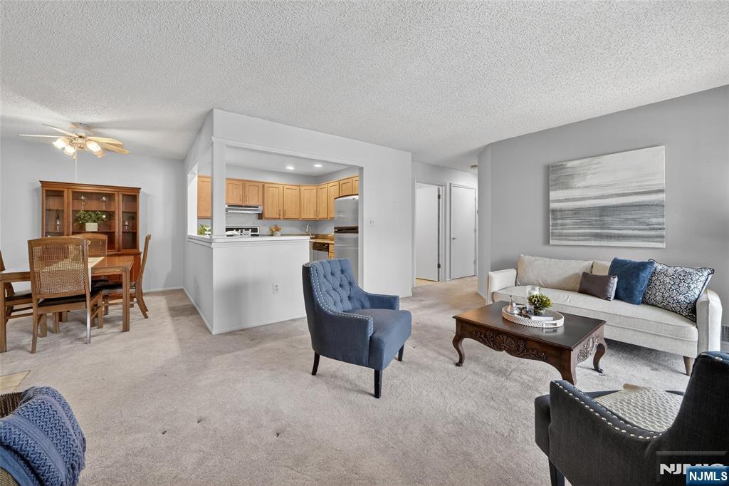 560 Holly Court Mahwah, NJ 07430 - Photo 11 of 33 a living room with furniture and a large window