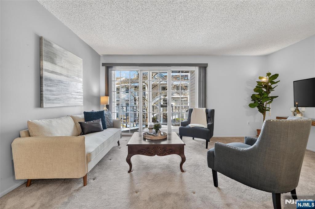 560 Holly Court Mahwah, NJ 07430 - Photo 14 of 33 a living room with furniture and a large window