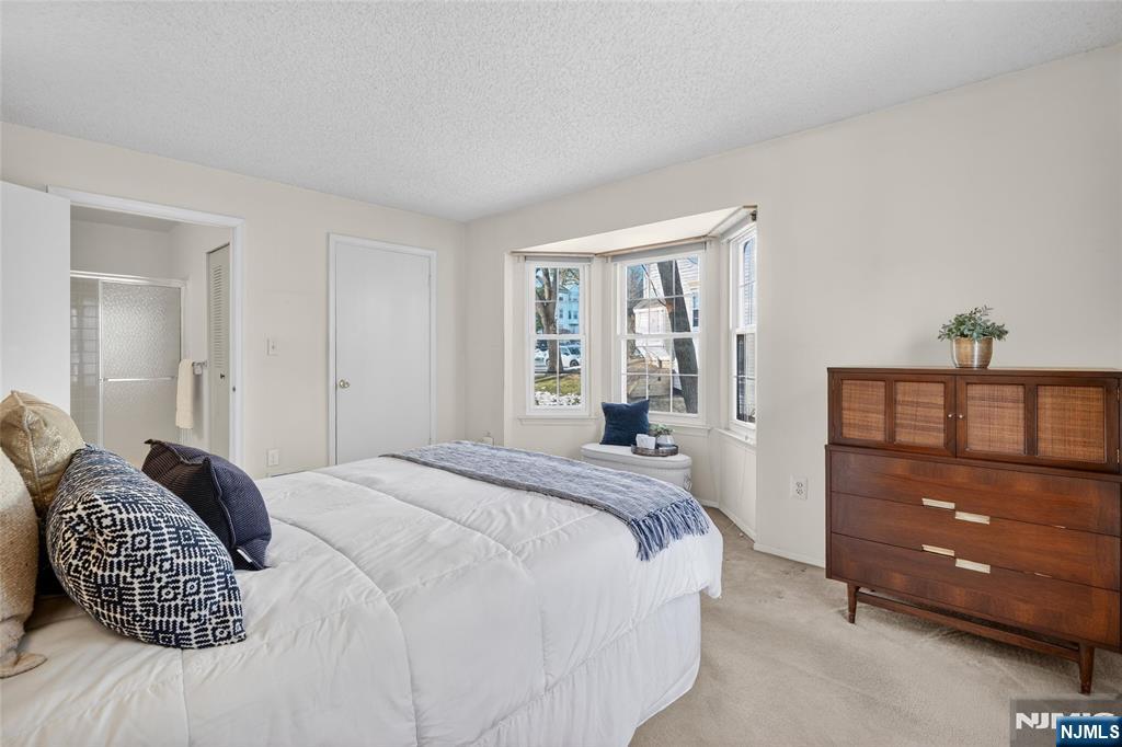 560 Holly Court Mahwah, NJ 07430 - Photo 24 of 33 a bedroom with a bed and a dresser