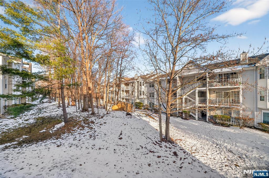 560 Holly Court Mahwah, NJ 07430 - Photo 30 of 33 a view of a building with snow on the road