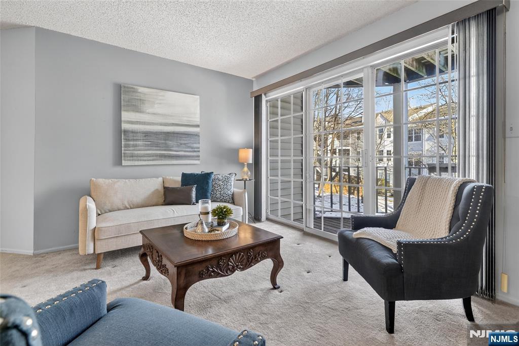 560 Holly Court Mahwah, NJ 07430 - Photo 9 of 33 a living room with furniture and a large window