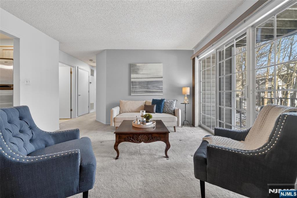 560 Holly Court Mahwah, NJ 07430 - Photo 10 of 33 a living room with furniture and a large window