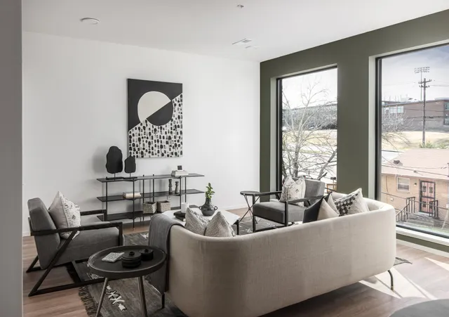 a living room with furniture and a window