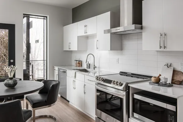a kitchen with a sink and cabinets