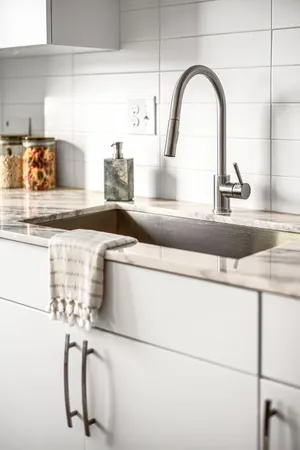 a close view of sink and cabinets