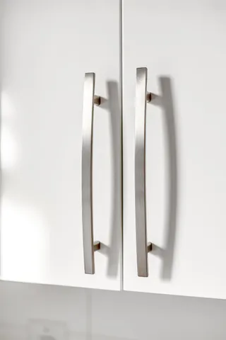 a bed room with a bed and a chair