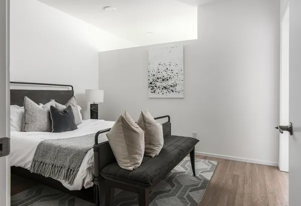 a bedroom with a bed and a window