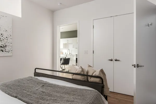a bathroom with a granite countertop sink mirror and toilet