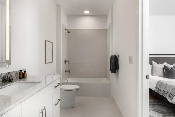 a kitchen with a sink and a mirror