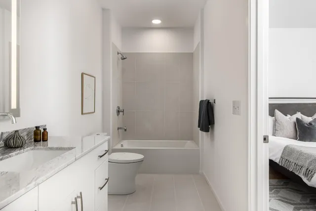 a kitchen with a sink and a mirror