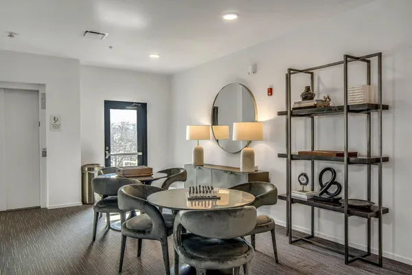 a terrace with outdoor seating and city view