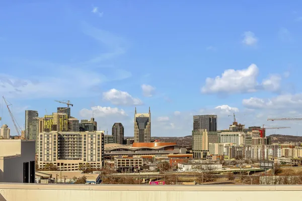 a bathroom with a mirror a sink and a shower