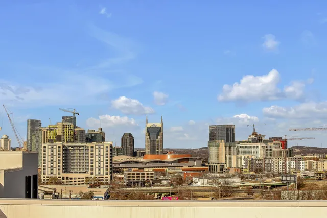 a bathroom with a mirror a sink and a shower