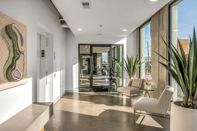 a view of a gym room with gym equipment
