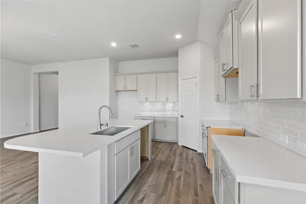 a bathroom with a double vanity sink and mirror