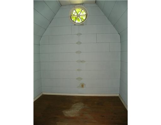 772 Highway 31 Ruffs Dale, PA 15679 - Photo 12 of 18 Storage. One of the many storage areas in the attic features a lovely round window.