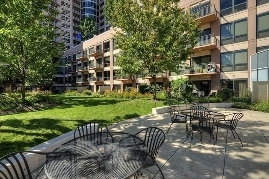 807 Davis Street, Unit 1307 Evanston, IL 60201 - Photo 20 of 22 a view of a patio with a yard