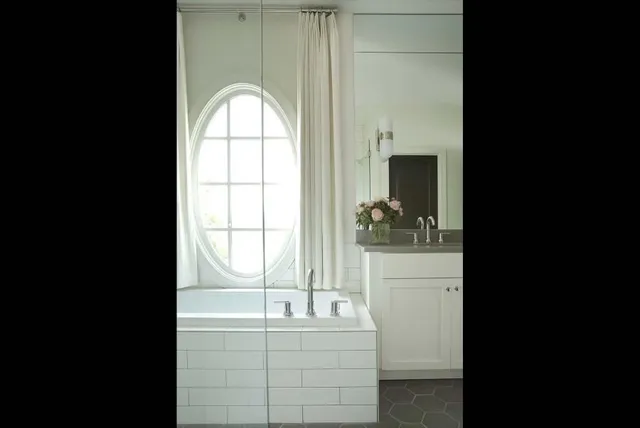 a bathroom with a granite countertop sink a toilet and a mirror