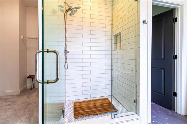 a bathroom with a double vanity sink toilet and a mirror