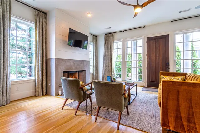 a living room with furniture and a lamp