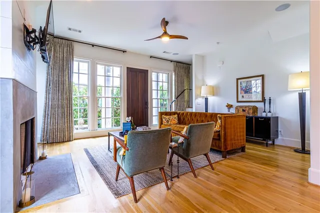 a kitchen with kitchen island granite countertop a stove a sink a window and dining table