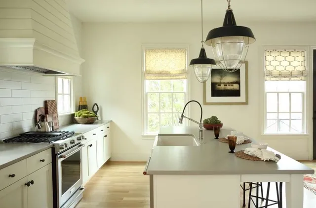 a kitchen with wooden cabinets and a stove top oven