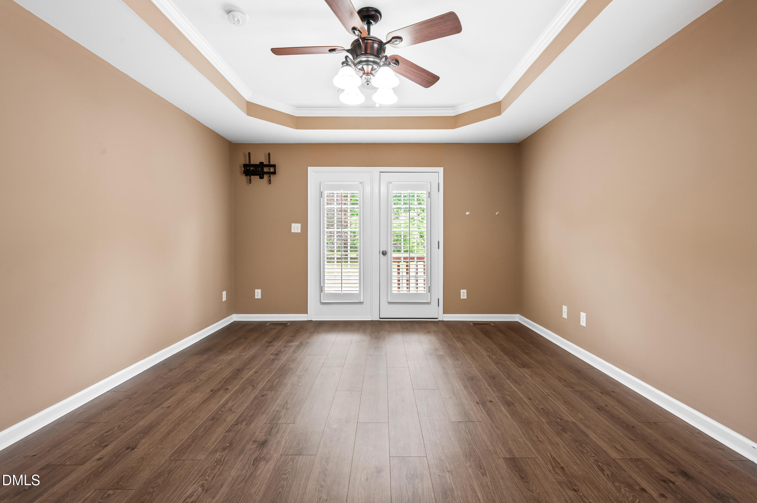 125 Rustic Lane Smithfield, NC 27577 - Photo 21 of 49 a view of an empty room with window and wooden floor