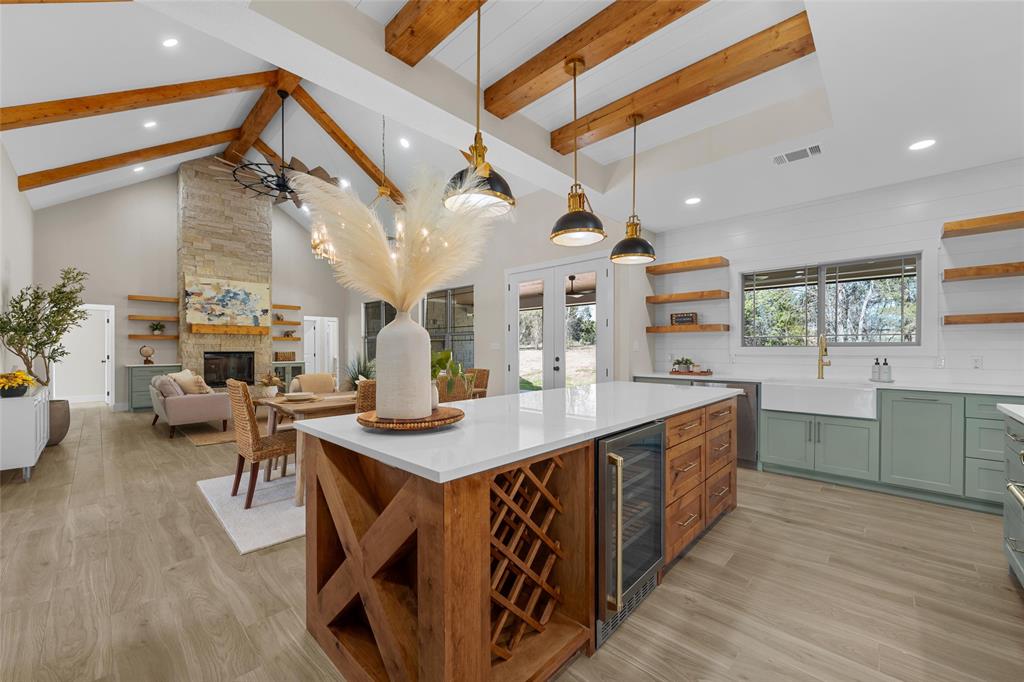 317 North Big Red Way China Spring, TX 76633 - Photo 11 of 40 a kitchen with sink cabinets and wooden floor