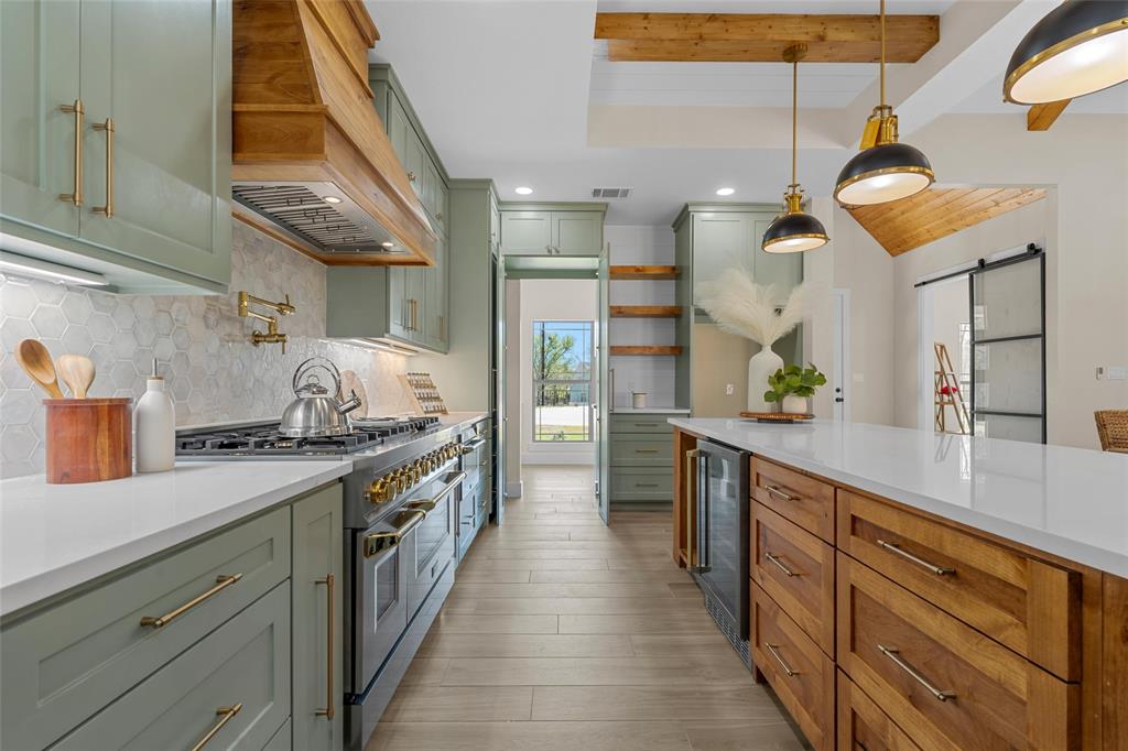317 North Big Red Way China Spring, TX 76633 - Photo 12 of 40 a large kitchen with stainless steel appliances lots of counter space and a sink