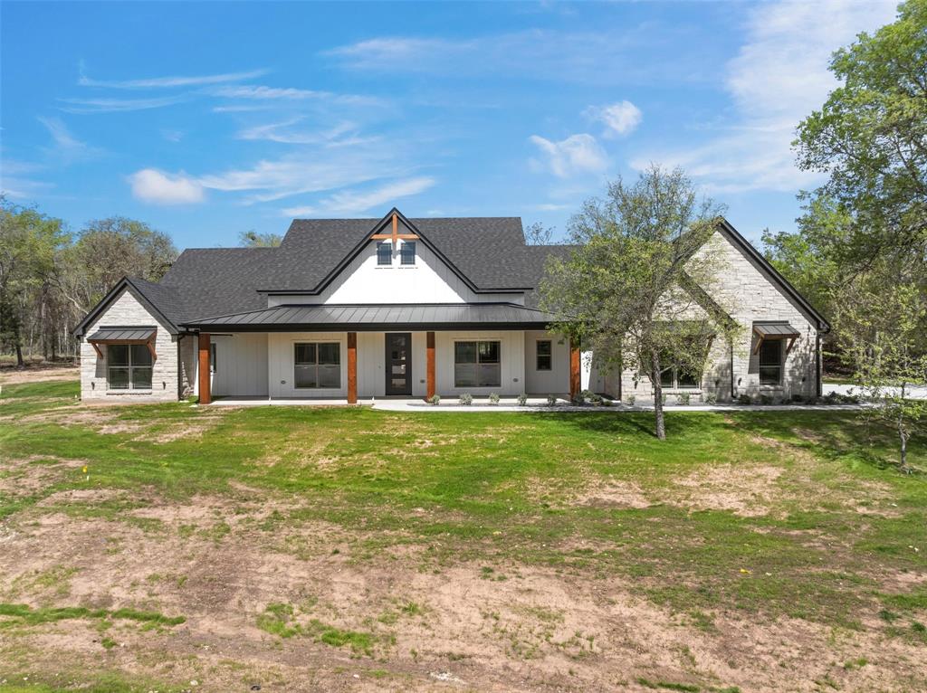 317 North Big Red Way China Spring, TX 76633 - Photo 2 of 40 a front view of a house with a garden