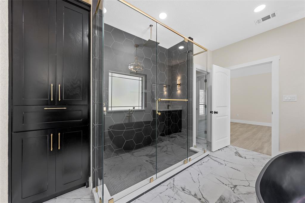 317 North Big Red Way China Spring, TX 76633 - Photo 21 of 40 a bathroom with a glass shower door