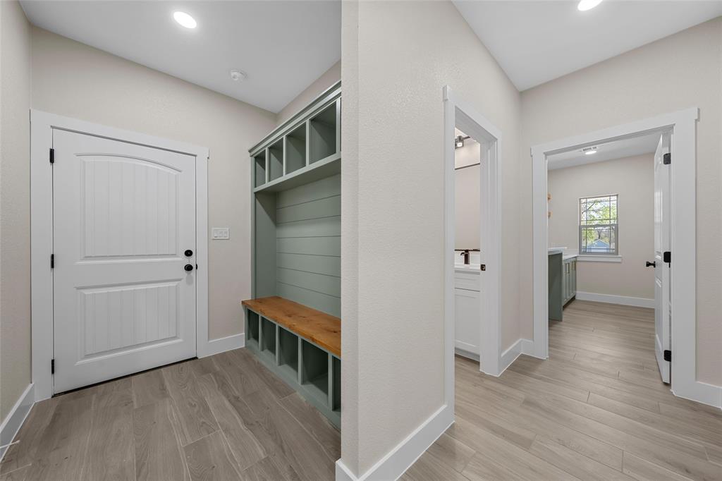 317 North Big Red Way China Spring, TX 76633 - Photo 23 of 40 a view of a hallway with wooden floor and closet area