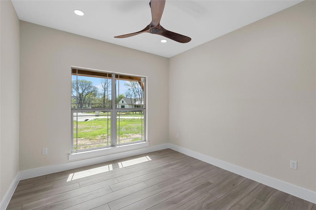 317 North Big Red Way China Spring, TX 76633 - Photo 24 of 40 a view of an empty room with wooden floor and a window